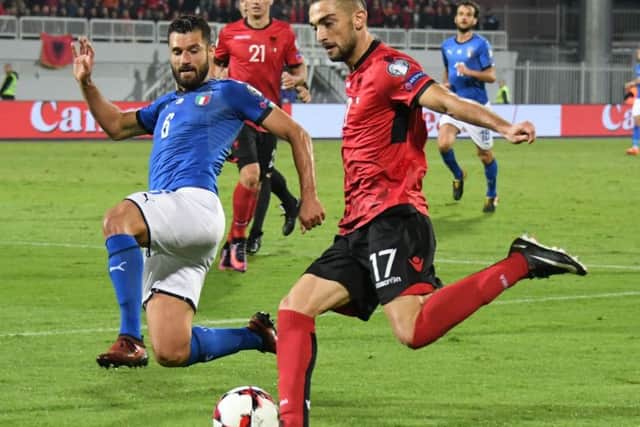 Eros Grezda, right, playing against Italy in World Cup qualification. Picture: AFP/Getty