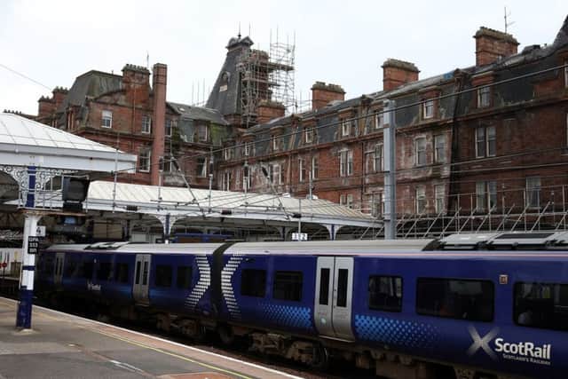 A train sits at Ayr station after the former Station Hotel (rear)  has been deemed unsafe. Picture: PA Wire