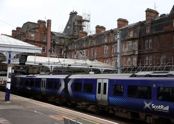 A train sits at Ayr station after the former Station Hotel (rear)  has been deemed unsafe. Picture: PA Wire