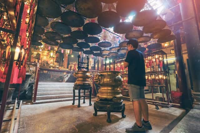 Incense and offerings at the Man Mo Temple, Hong Kong