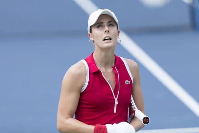 Alize Cornet was handed a code violation for removing her top on court. Picture: Shutterstock