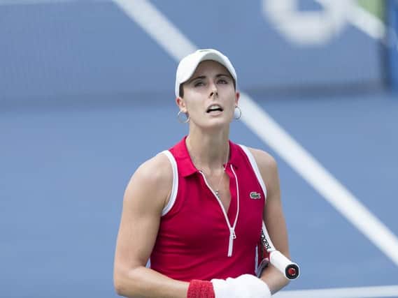 Alize Cornet was handed a code violation for removing her top on court. Picture: Shutterstock