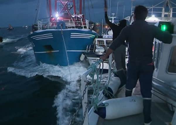 Fishing boats collide in the English Channel after a dispute between French and Scottish fishermen turned nasty (France 3 via AP)