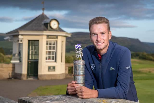 Frenchman Victor Veyret shows off the Carrick Neill Scottish Open Stroke Play Championship trophy after his win at Gleneagles. Picture: Kenny Smith