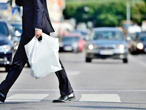 The Scottish Government currently requires all retailers to charge 5p per single-use bag (Photo: Shutterstock)