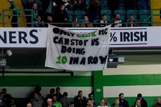 Celtic fans unveil a banner aimed at the Celtic board. Picture: SNS Group