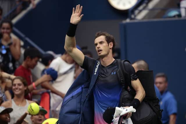 Beaten but not bowed. Andy Murray waves to his fans following his second-round defeat by Fernando Verdasco at the US Open. Picture: AP.