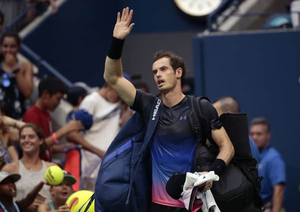 Beaten but not bowed. Andy Murray waves to his fans following his second-round defeat by Fernando Verdasco at the US Open. Picture: AP.