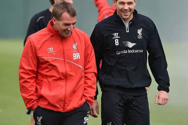 Steven Gerrard talks with Brendan Rodgers during a Liverpool training session. Picture: Andrew Powell/Liverpool FC via Getty