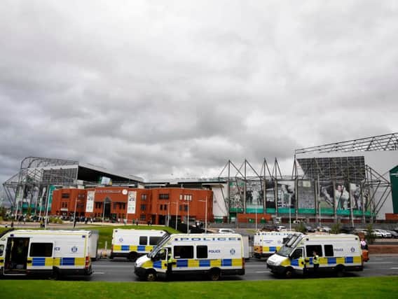 Five fans were injured in a crush at Celtic Park.