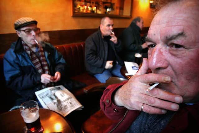 Smokers happily puff away in Wilkies Bar, Leith, in 2005. Smoking in bars and restaurants was banned in Scotland the following year. Picture: David Moir/TSPL
