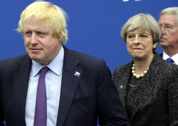 Boris Johnson claims Theresa May is leading the UK into a disaster with her Brexit deal proposals (Picture: Thierry Charlier/AP)