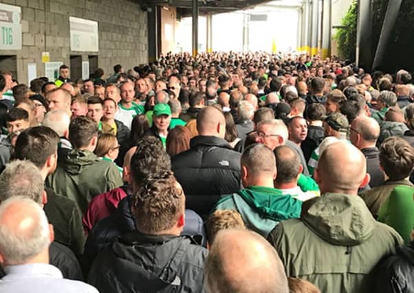 Fans attempt to enter Celtic Park ahead of the Old Firm match with Rangers. Picture: PA