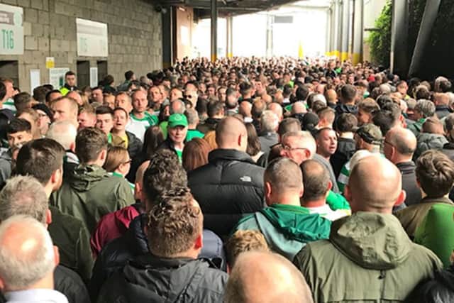 Fans attempt to enter Celtic Park ahead of the Old Firm match with Rangers. Picture: PA