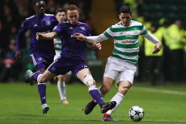 Adrien Trebel vies with Tom Rogic during the UEFA Champions League group match between Celtic and Anderlecht at Celtic Park. Picture: Getty images