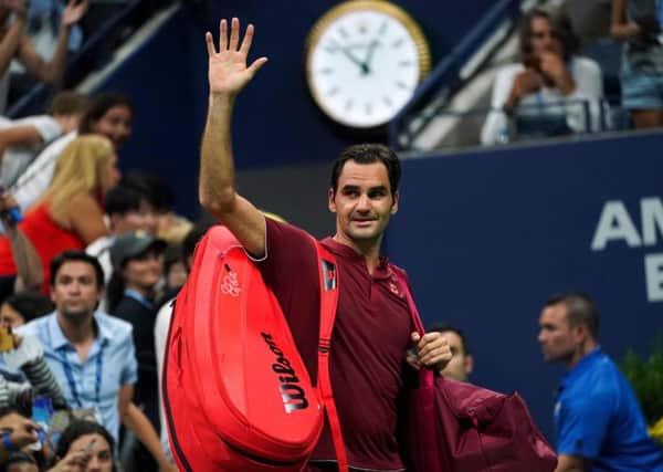 Roger Federer waves as he walks off court after losing to Australia's John Millman at the US Open. Picture: Eduardo Munoz Alvarez/AFP/Getty Images