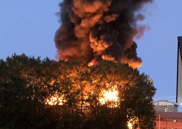 A large blaze has ripped through a carwash, Sponge N' Hoses, in Hamilton. Picture: Chris Newlands/PA Wire