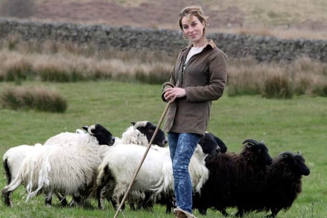 Shepherdess Emma Gray, 26 who lives solitary life on her 150 acre farm in 2012. Picture: SWNS
