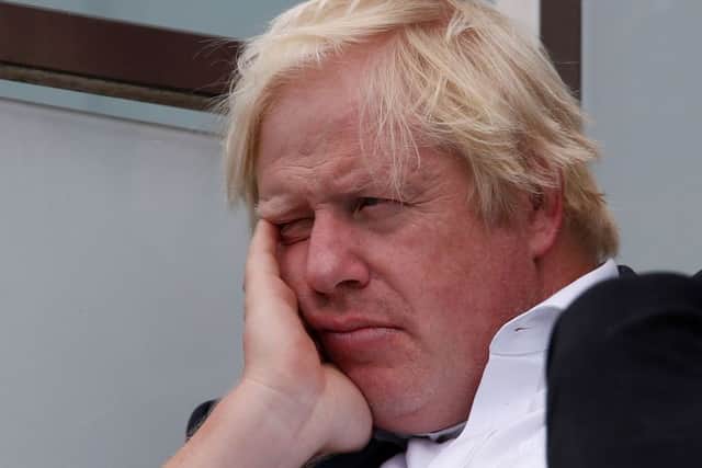 Boris Johnson seems a bit down in the dumps as he watches England play India at cricket (Picture: Ian Kington/AFP/Getty Images