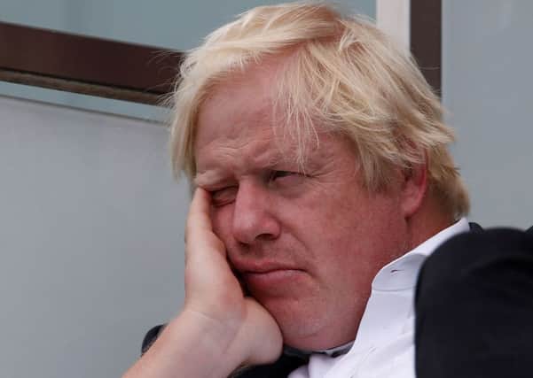 Boris Johnson seems a bit down in the dumps as he watches England play India at cricket (Picture: Ian Kington/AFP/Getty Images