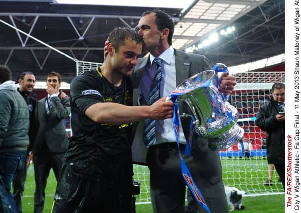 Wigan manager Roberto Martinez with Shaun Maloney after beating Man City in the 2013 FA Cup final. Picture: The FA/REX/Shutterstock