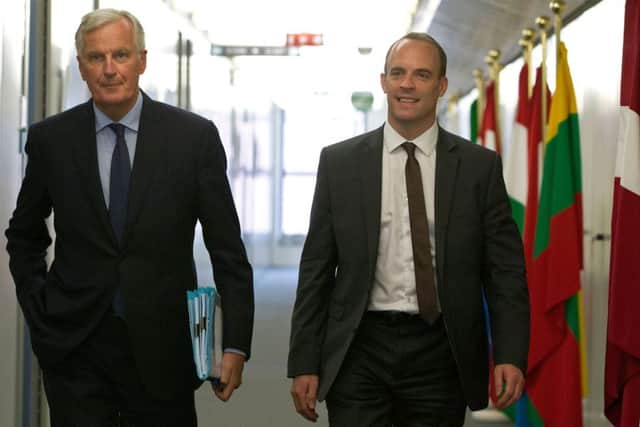EU Brexit pointman Michel Barnier (L) and Brexit Minister Dominic Raab (R) in Brussels. Picture: AFP/Getty