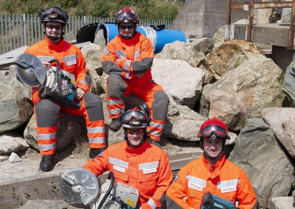 John Aitchison, front right, and members of the Isar team at the Scottish Fire and Rescue Services training centre in Portlethen. Picture: Contributed