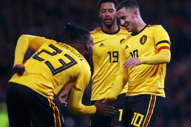 Michy Batshuayi of Belgium, who scored twice in the 4-0 win, celebrates with Eden Hazard and Mousa Dembele. Picture: Ian MacNicol/Getty Images