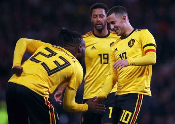 Michy Batshuayi of Belgium, who scored twice in the 4-0 win, celebrates with Eden Hazard and Mousa Dembele. Picture: Ian MacNicol/Getty Images