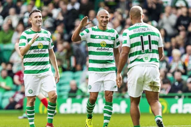Celtic's Gabby Agbonlahor celebrates with Larsson and Keane. Pic: SNS/Roddy Scott