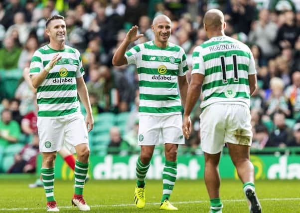 Celtic's Gabby Agbonlahor celebrates with Larsson and Keane. Pic: SNS/Roddy Scott