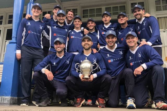 Grange players celebrate with the Scottish Cup after completing their historic treble with victory over Heriots.
Picture: Ramsay Jones