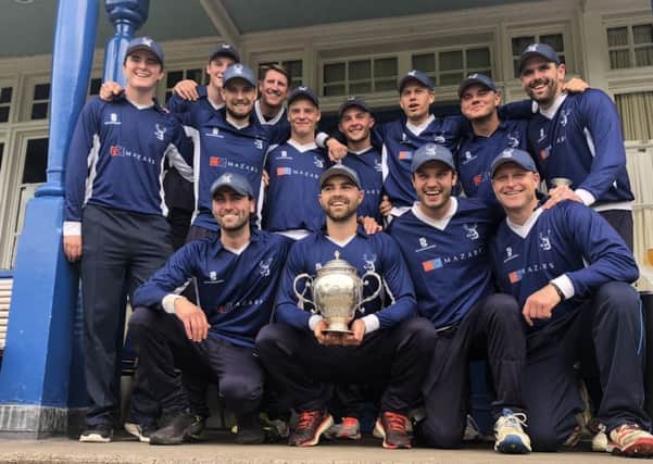 Grange players celebrate with the Scottish Cup after completing their historic treble with victory over Heriots.
Picture: Ramsay Jones