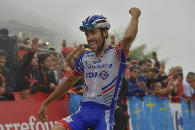 Thibaut Pinot of France crosses the line at Lagos de Coavadonga to win stage 15 of La Vuelta. Picture: AP.