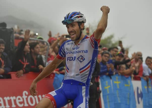 Thibaut Pinot of France crosses the line at Lagos de Coavadonga to win stage 15 of La Vuelta. Picture: AP.