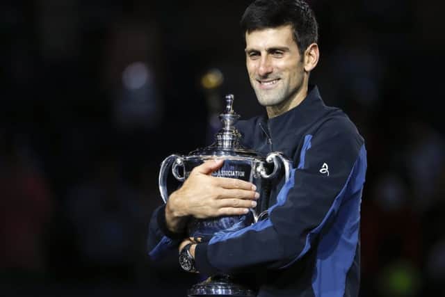 Novak Djokovic holds the US Open trophy after defeating Juan Martin del Potro in the final. Picture: AP Photo/Adam Hunger