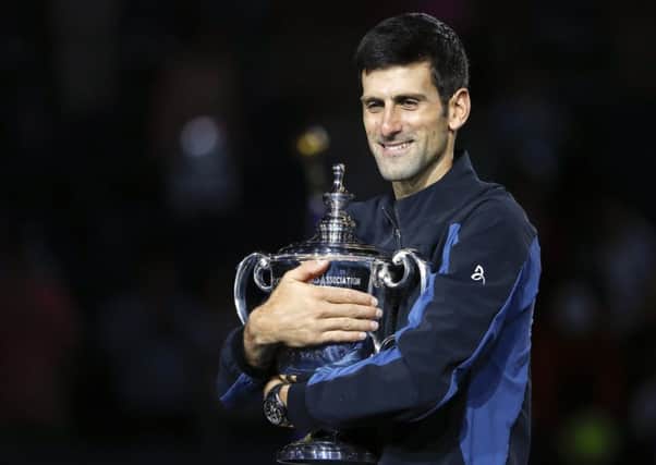 Novak Djokovic holds the US Open trophy after defeating Juan Martin del Potro in the final. Picture: AP Photo/Adam Hunger