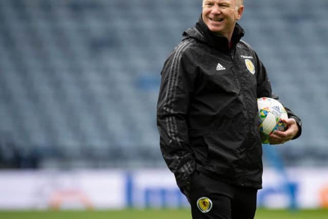 Alex McLeish will continue with the back three against Albania.