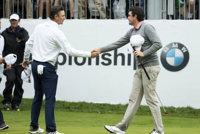 England's Justin Rose, left, congratulates Keegan Bradley after the American won the BMW Championship in a sudden-death play-off. Picture: Chris Szagola/AP