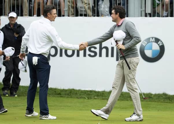 England's Justin Rose, left, congratulates Keegan Bradley after the American won the BMW Championship in a sudden-death play-off. Picture: Chris Szagola/AP