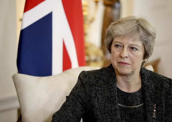 Theresa May's Government is prioritising plans to prevent 'personation', a very rare problem, by introducing measures that will disenfranchise many people (Picture: Matt Dunham/PA Wire)