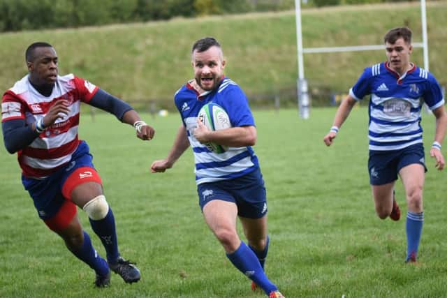 Man of the match Sean Murray darts through Whitecraigs defence. By Chris Reekie.