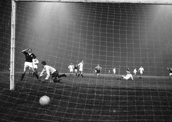 Denis Law scores his fourth goal in a 6-1 rout of Norway at Hampden in 1963. When will such glory days return?