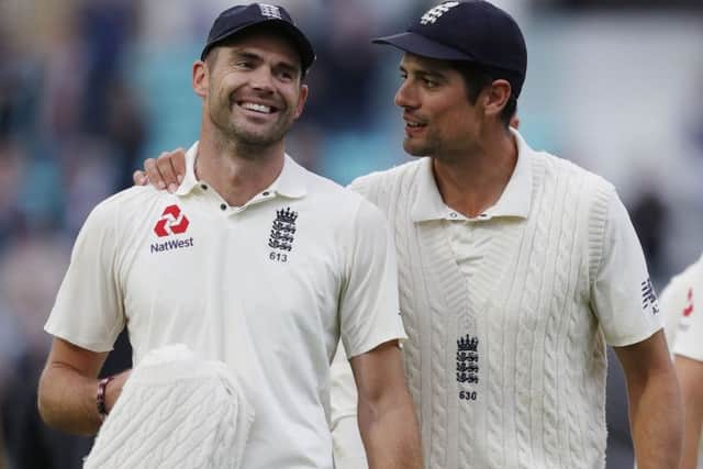 James Anderson, left, is congratulated by Alastair Cook after breaking Glenn McGraths record. Picture: Getty.