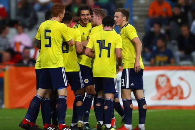 Fraser Hornby, centre, celebrates after scoring the first of his two goals in Scotland U21s' European Championship qualifying win over Netherlands. Picture: Getty