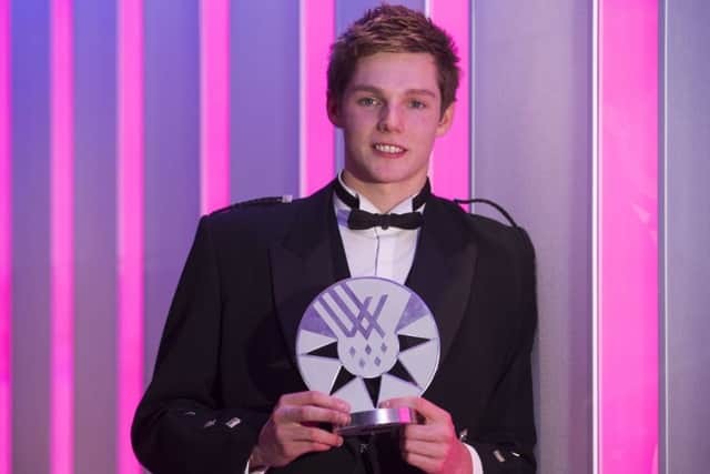 Duncan Scott with his award at the ceremony in Edinburgh. Picture: Jeff Holmes