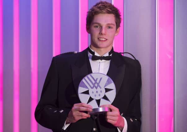 Duncan Scott with his award at the ceremony in Edinburgh. Picture: Jeff Holmes