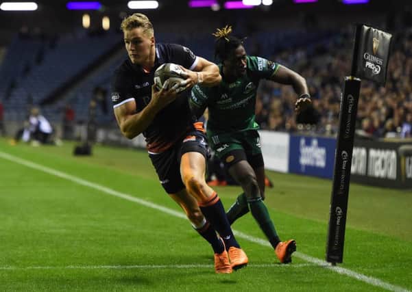 Edinburgh wing Duhan van der Merwe crosses the line to score the opening try of the night at BT Murrayfield. Picture: SNS