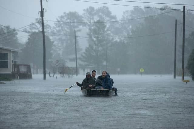 Volunteers from all over North Carolina help rescue residents from their flooded homes during Hurricane Florence September 14, 2018 in New Bern, North Carolina. Getty