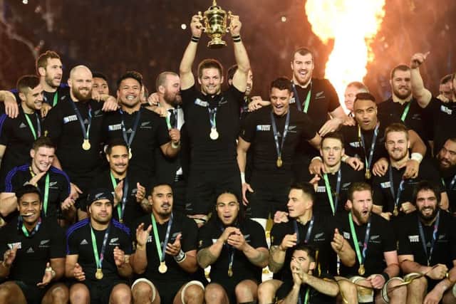New Zealand's captain Richie McCaw holds the Webb Ellis Cup. Martin Bureau/AFP/Getty Images